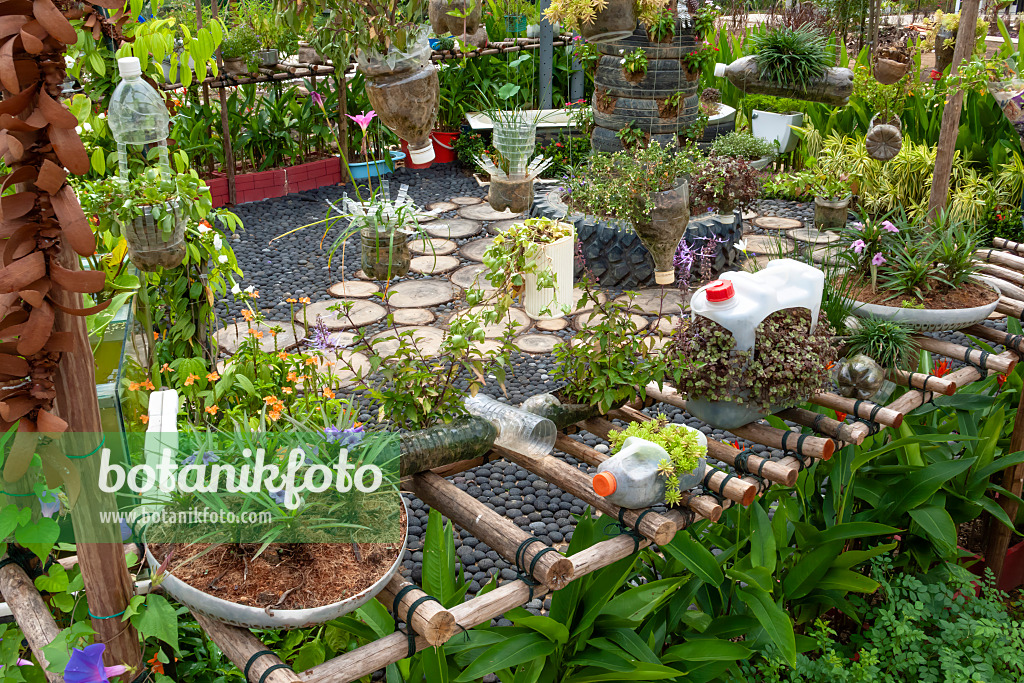 455413 - Flower pots made of used plastic bottles and bowls, Recycling Garden, HortPark, Singapore