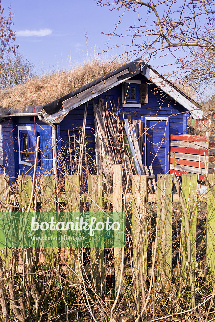 578037 - Garden house with green roof in a natural garden