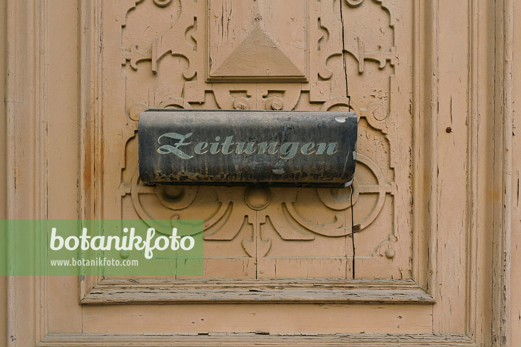 559065 - Old carved front door with letterbox for newspapers, Görlitz, Germany