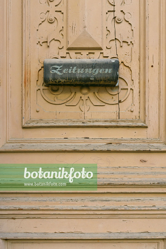 559066 - Old carved front door with letterbox for newspapers, Görlitz, Germany