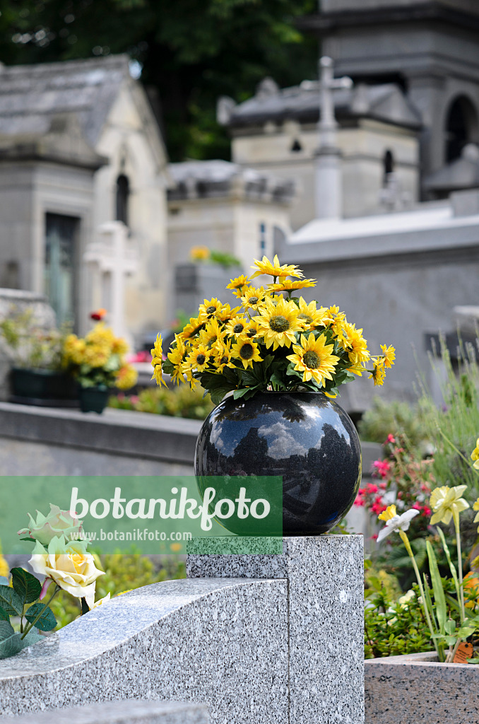 521414 - Plastic flowers on a tombstone