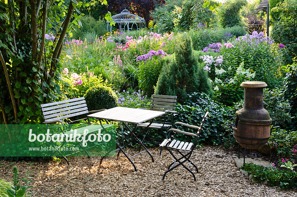 474454 - Seating area with oven in a perennial garden