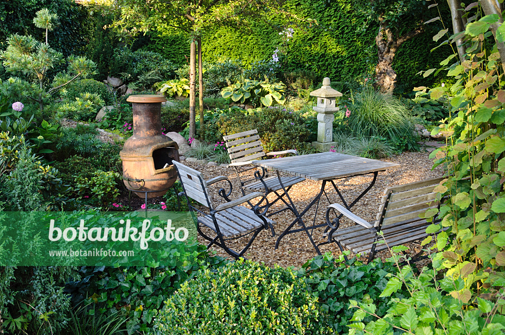 474464 - Seating area with oven in a perennial garden