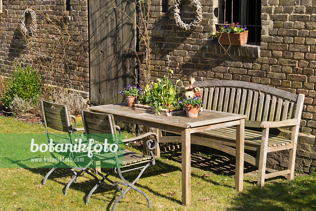 554072 - Seating area with spring decoration in front of a barn