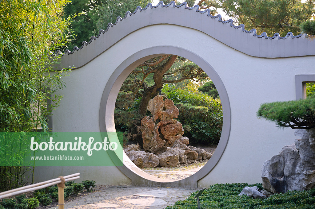 517111 - View of rock formation through a moon gate in a Chinese garden