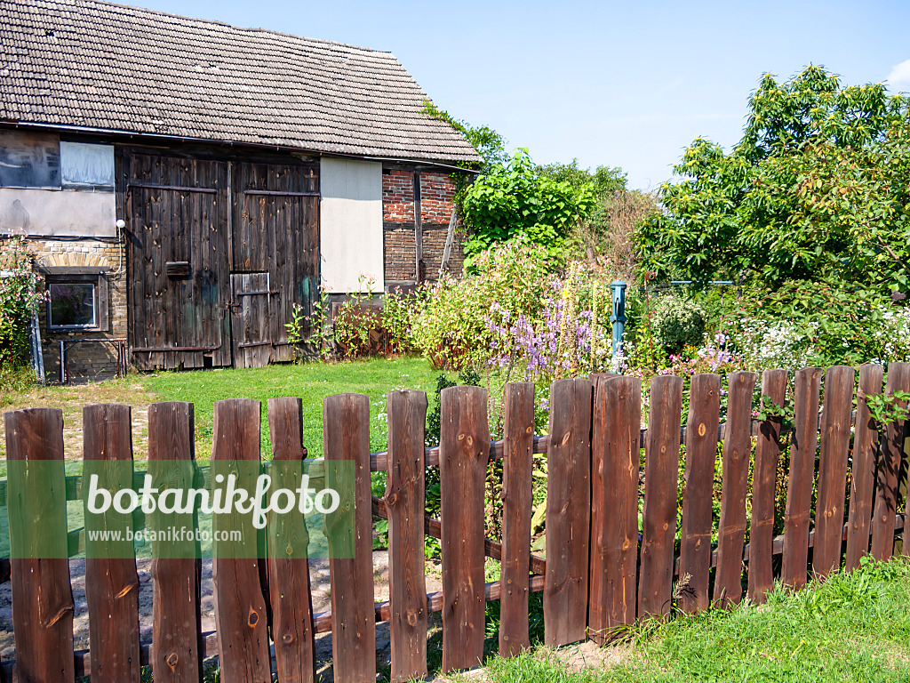 513097 - Wooden fence at a barn