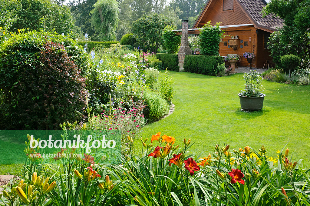 474106 - Wooden house with lawn and perennial beds