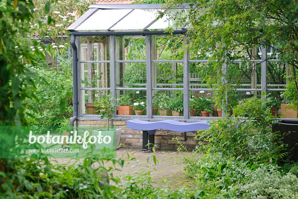 509143 - Blue bench at a wooden greenhouse