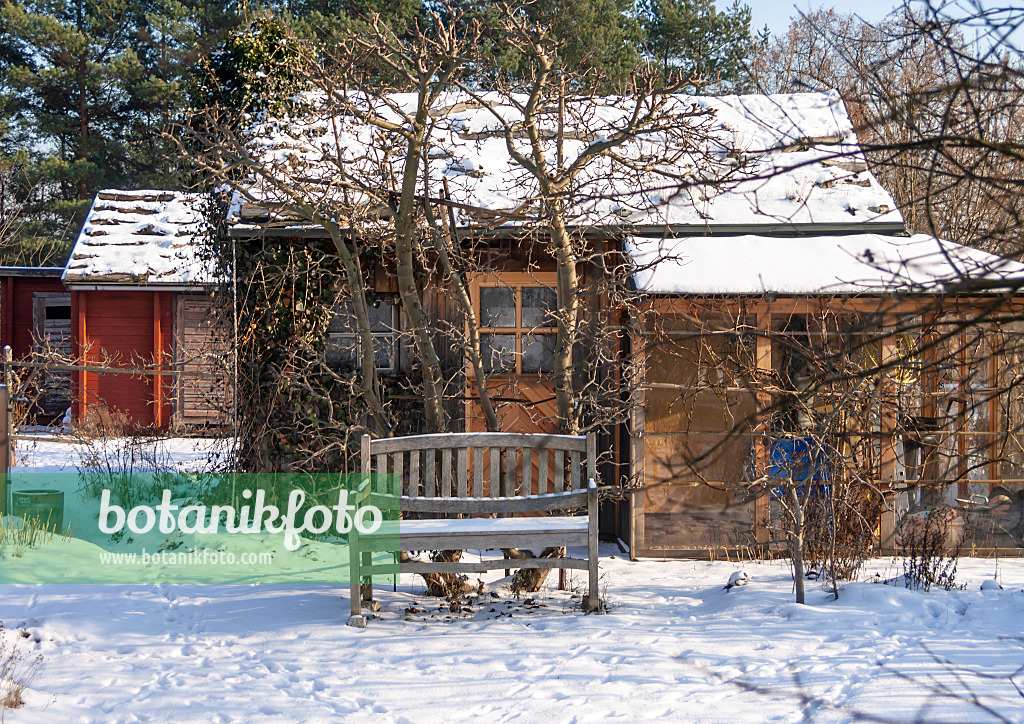 516037 - Garden house in a snowy natural garden