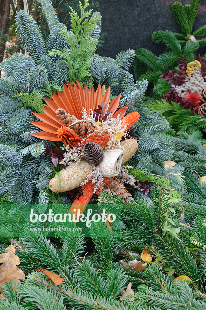 466026 - Grave decoration with fir branches, cones and dyed plant parts