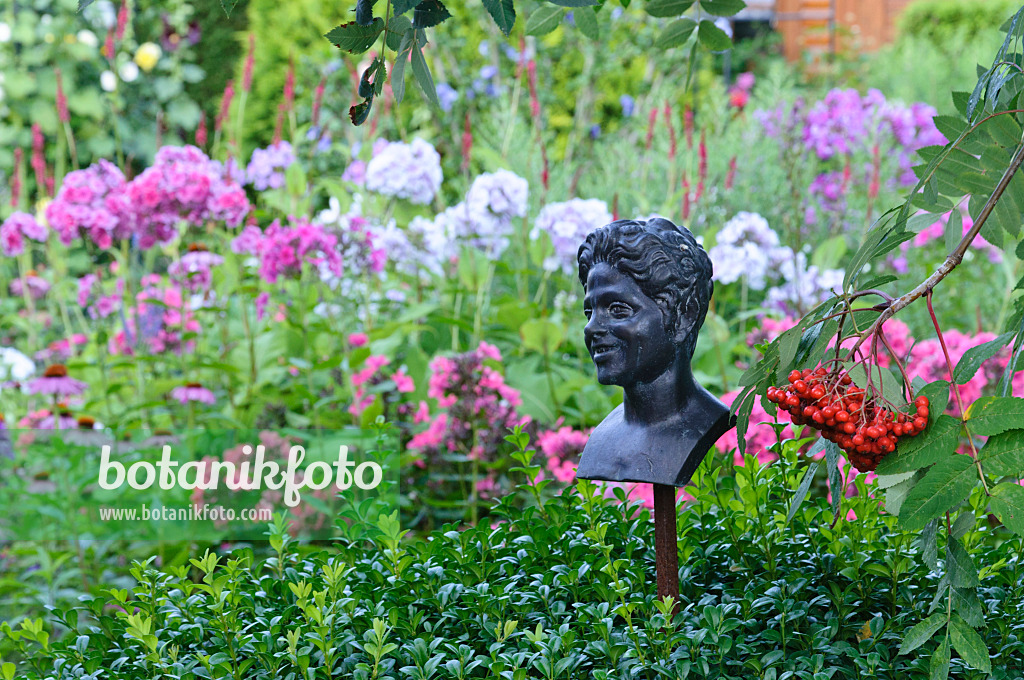 474478 - Metal figure with rowan (Sorbus aucuparia) and garden phlox (Phlox paniculata)