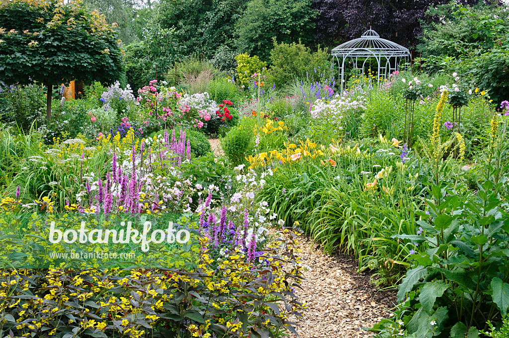 474085 - Rich flowering garden with pavilion