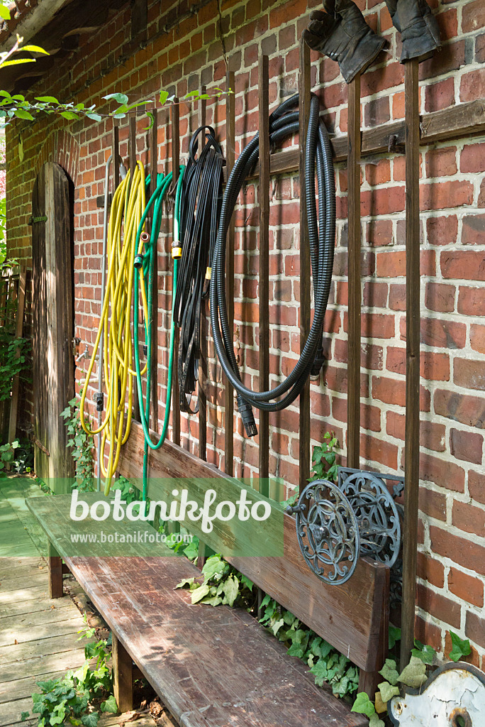 558289 - Water hoses on  a wall