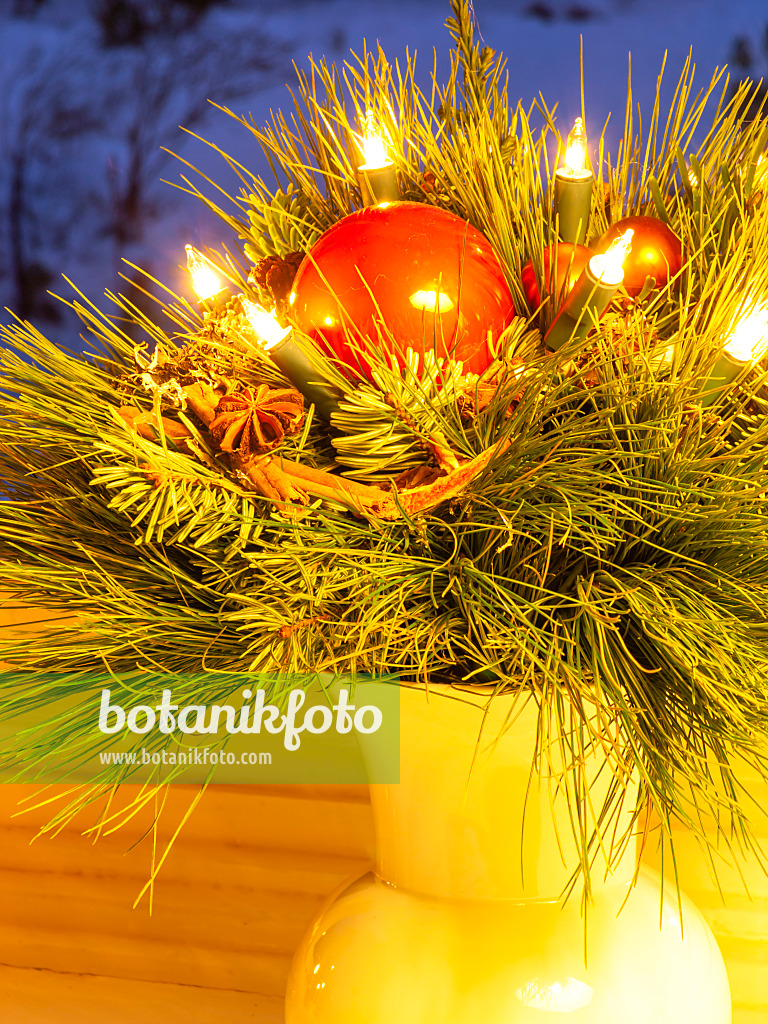 433011 - Christmas bouquet with red balls and burning electric candles in a vase