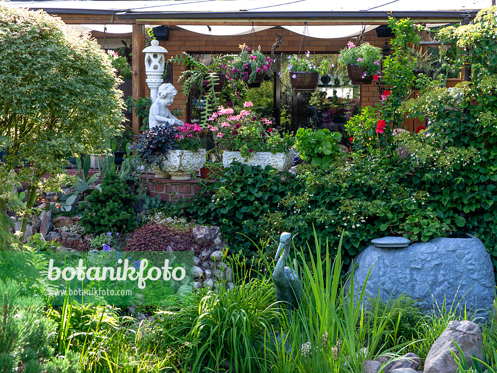 449060 - Garden house with potted plants