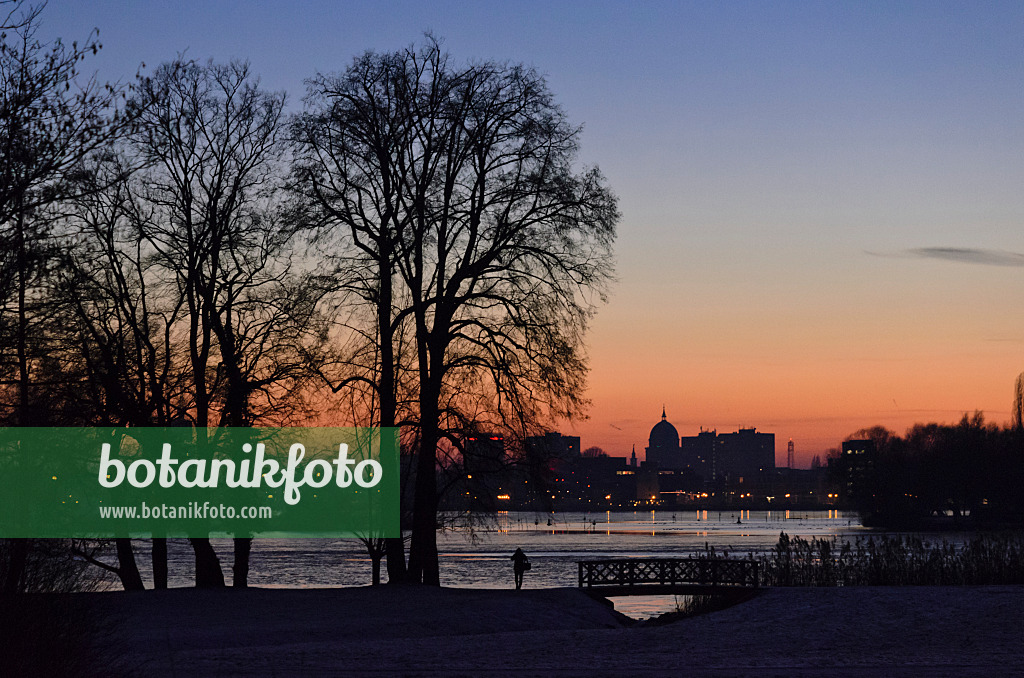 553007 - Glienicke Lake and silhouette of Potsdam at sunset, Germany
