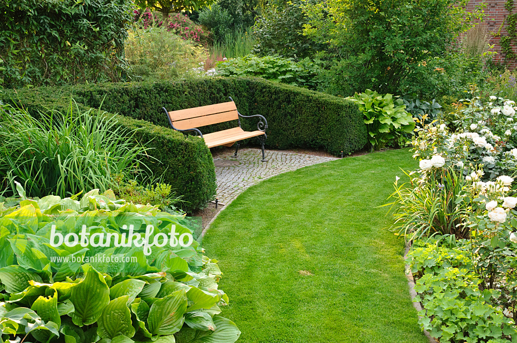 474078 - Grass path in a perennial garden with bench