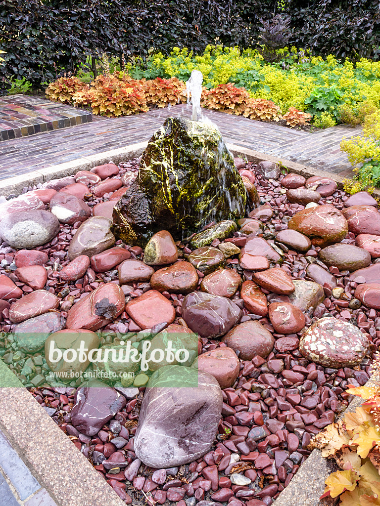462149 - Perennial garden with stone fountain