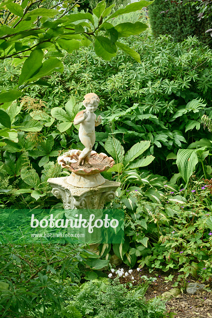 559080 - Sculpture in a perennial garden
