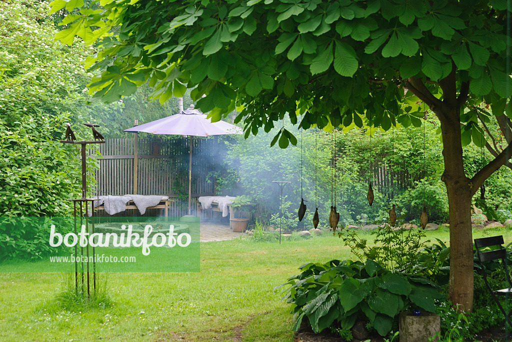 509142 - Seating area with fireplace in a garden