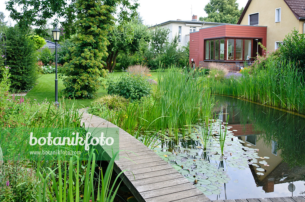 474040 - Swimming pond with wooden decking area
