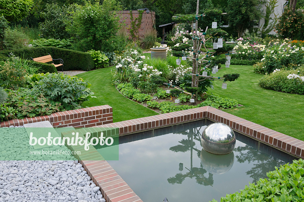 474063 - Water basin at the edge of a rose garden