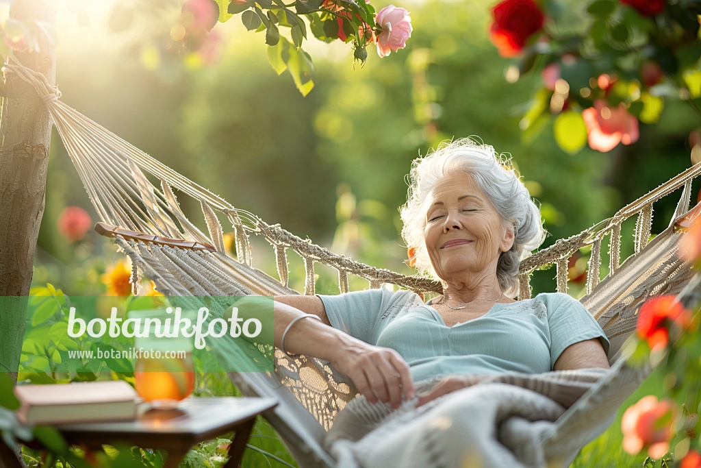 667053 - Woman lying in a hammock