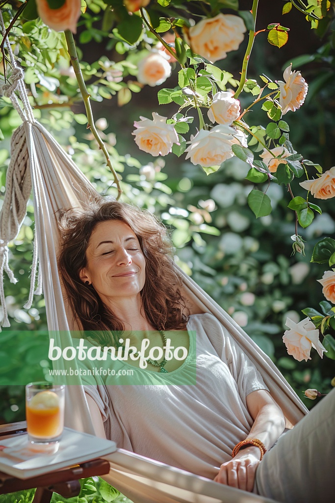 667057 - Woman lying in a hammock