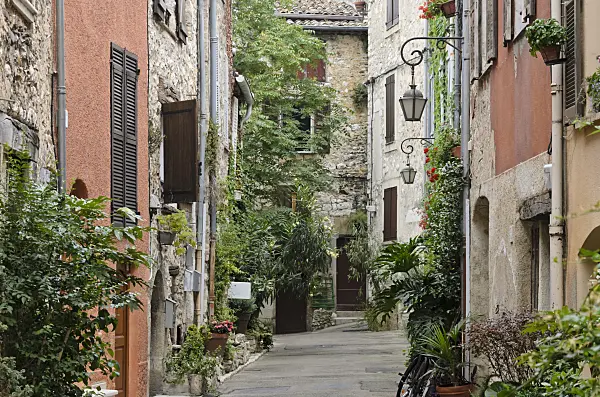 569091 - Alley with flower tubs in the old town, Vence, France