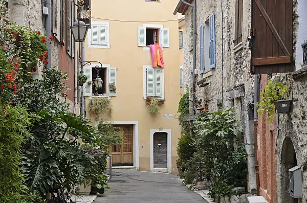 569092 - Alley with flower tubs in the old town, Vence, France