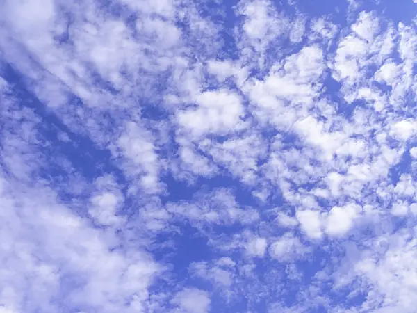 451058 - Altocumulus clouds under a deep blue sky