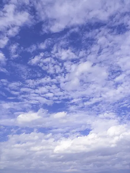 451060 - Altocumulus clouds under a deep blue sky