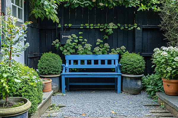 667061 - Banc bleu dans un jardin néerlandais avec des plantes en pot