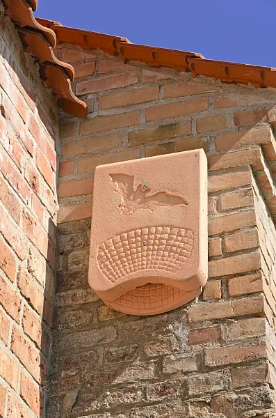 534311 - Bat box made of modelled clay on a red brick wall