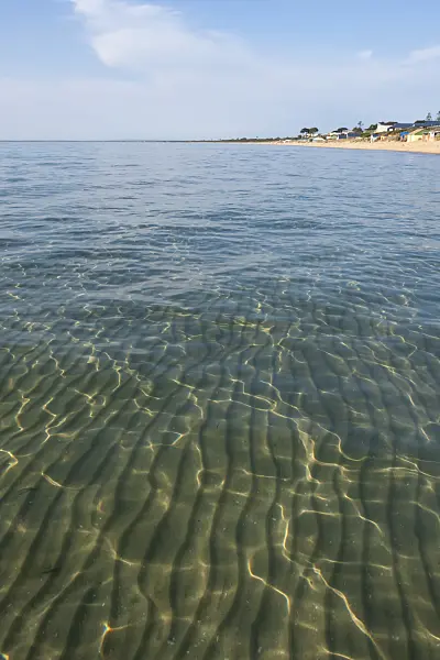 455193 - Beach with clear water and sun reflections at Port Phillip Bay, Frankston, Australia
