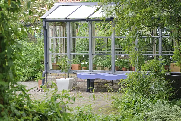 509143 - Blue bench at a wooden greenhouse