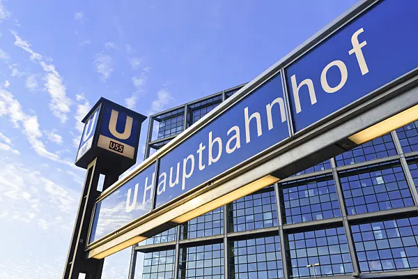 551024 - Blue underground sign with the glass facade of the main station, Berlin, Germany