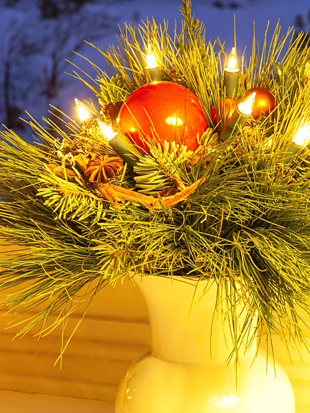 433011 - Christmas bouquet with red balls and burning electric candles in a vase