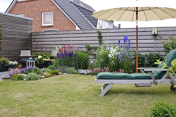 500180 - Deck chair and seating area in a garden