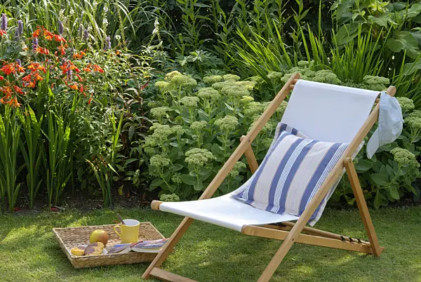 456029 - Deck chair on a lawn