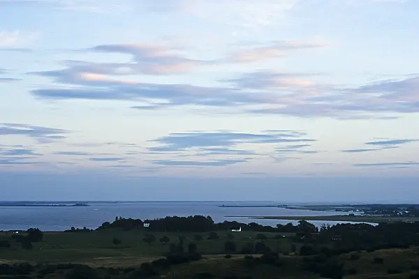 382027 - Evening clouds in the bluish light above the sea, Hiddensee, Germany