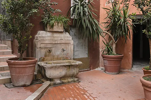 569024 - Fountain and plant containers in the old town, Cannes, France
