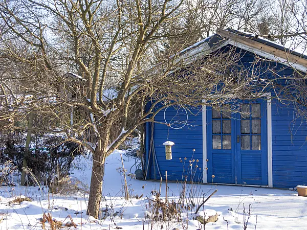 516036 - Garden house in a snowy natural garden