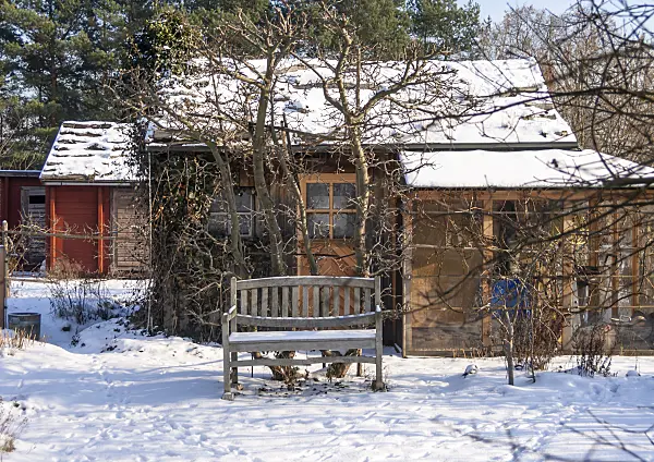 516037 - Garden house in a snowy natural garden