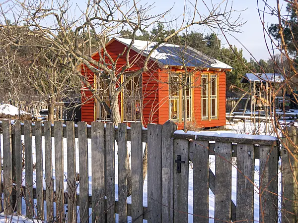 516039 - Garden house in a snowy natural garden