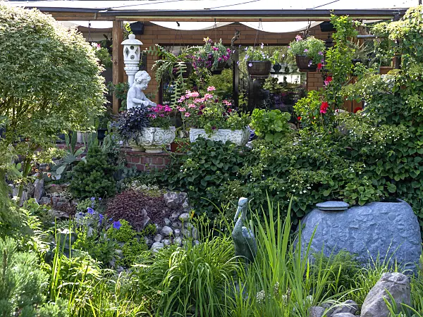 449060 - Garden house with potted plants