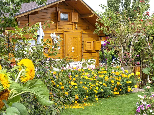 476183 - Garden house with summer flowers