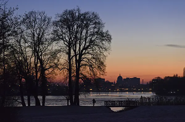 553007 - Glienicke Lake and silhouette of Potsdam at sunset, Germany