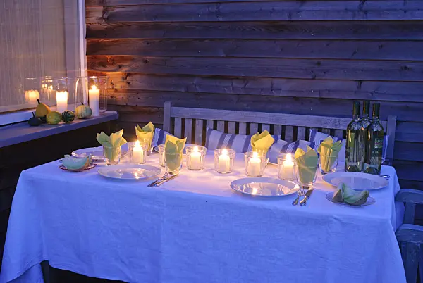 483035 - Laid table with candles on a terrace