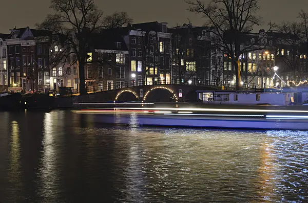 564011 - Light tracks of canal boats, Amsterdam, Netherlands